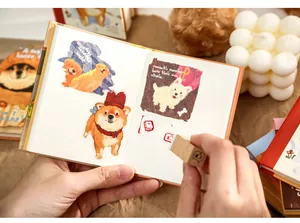 Detailed view of an open A7 pocket notebook featuring cute dog illustrations and stamps