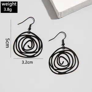 Detailed view of black irregular spiral drop earrings with 5cm length and 3.8g weight.