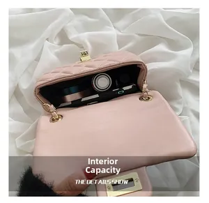 Internal capacity of pink quilted chain bag showing phone and lipstick storage