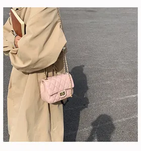 Pink quilted shoulder bag with gold chain strap and turn-lock on soft pink leather