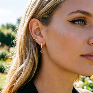 Elegant S925 sterling silver earrings featuring blue zircon in a French retro style design