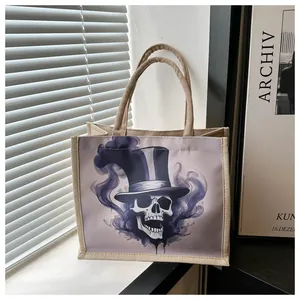 Detail of jute tote bag with skull print and top hat under window blinds light