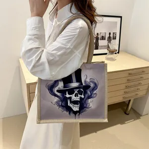 Stylish gothic skull canvas tote bag with woven handles for daily use by women