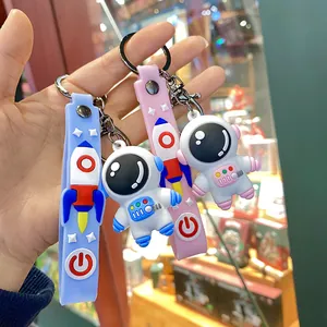 Cute 3D cartoon astronaut keychain with silicone rocket strap for schoolbags and keys