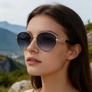 Close-up of stylish oval sunglasses with clover detail in a scenic outdoor setting