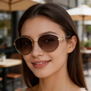 Close-up of women's fashion oval sunglasses with clover metal ornament detail