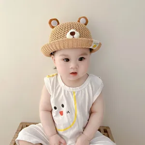 Cute baby straw sun hat featuring bear ears and breathable woven texture for summer.
