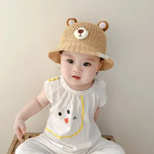 Detailed view of breathable baby straw sun hat with cute bear ears and facial features