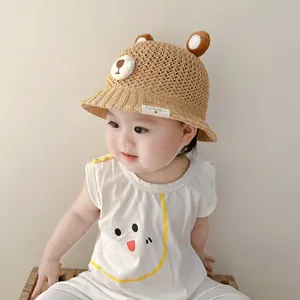 Breathable baby bear straw hat for summer sun protection with cute ears and chin strap detail.