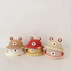 Group of colorful breathable children's straw sun hats with cute bear ear details