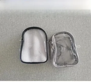 Detail view of transparent PVC crossbody bags with zipper closure in black and gray color