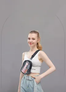Detail of clear PVC crossbody bag showing internal storage for cosmetics and black strap