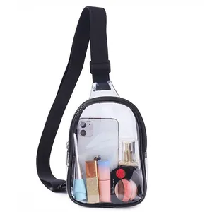 Clear PVC crossbody bag with black trim showing interior phone and cosmetics