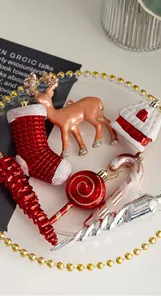 Detailed view of assorted Christmas ornaments including reindeer and stockings on a tray