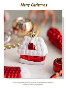 Close-up of red and white snow-dusted house ornament hanging on a Christmas tree