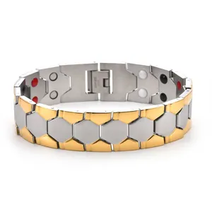 Macro detail of men's magnetic therapy bracelet showing bicolor links and magnets