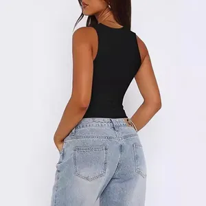 Back view of a slim-fit black sleeveless tank top paired with light blue washed jeans