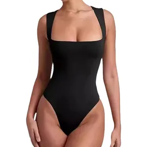 Detail of a black square neck bodysuit with thick straps and high-cut leg opening