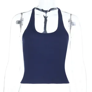 Detail of navy blue ribbed knit crop top featuring a supportive athletic U-neck cut
