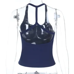 Detail of navy blue ribbed crop top featuring Y-shaped back straps and backless cut