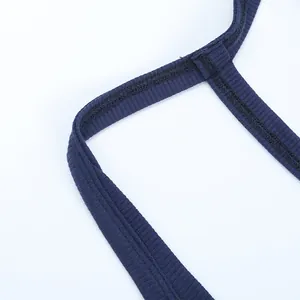 Close-up of fine rib-knit fabric with double-needle stitching on dark blue tank top