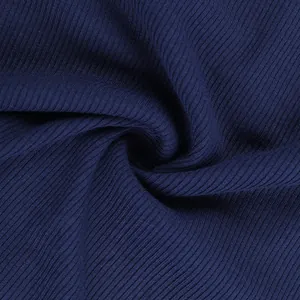 Close-up of dark blue ribbed knit fabric showing detailed vertical texture and elasticity
