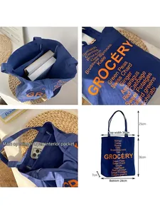 Vintage navy canvas tote bag with orange lettering and large capacity dimensions