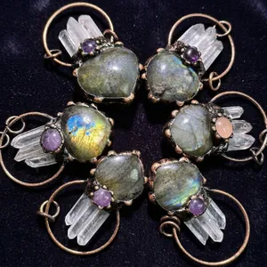 Handcrafted heart labradorite pendants with amethyst and white crystal points in bronze