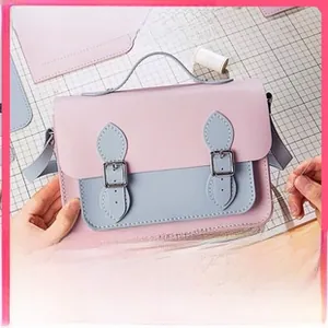 DIY handmade leather mini satchel kit featuring pink and blue color-block design on grid mat