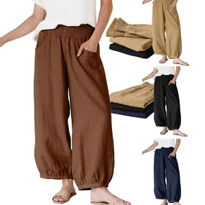 Detail view of high-waist lantern pants showing elastic waist and side pockets