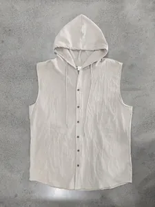 Macro detail of breathable linen blend fabric and buttons on a men's hooded vest