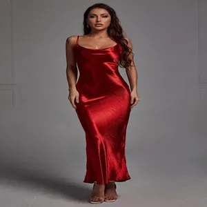 Detail of red satin slip maxi dress showing glossy fabric texture and v-neckline