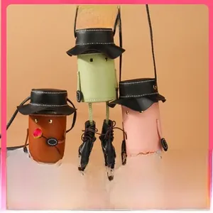 Detailed view of handmade DIY mini cartoon coin purses with unique leg designs