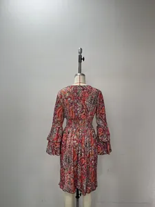 Detail view of paisley print dress with elastic waist and tiered ruffle cuffs