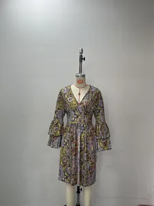 Close-up of triple-layered ruffle flared sleeves on paisley print V-neck dress
