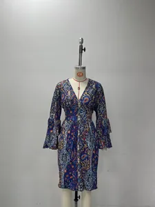 Detail of V-neckline and paisley print pattern on bohemian ruffle sleeve dress