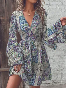 Detail of V-neckline and layered bell sleeves on paisley print bohemian dress