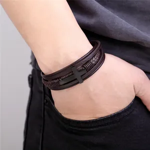 Men's multi-layer braided brown leather bracelet featuring a black metal cross pendant