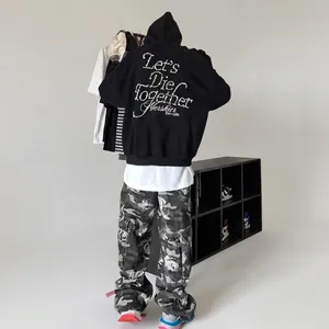 Streetwear black hoodie with pearl lettering and camouflage cargo pants outfit