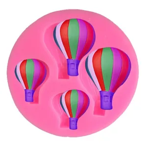 Pink silicone mold with 4 hot air balloon shapes for DIY cake decorating projects