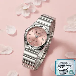 Macro view of pink dial quartz watch with silver link bracelet and roman numeral bezel