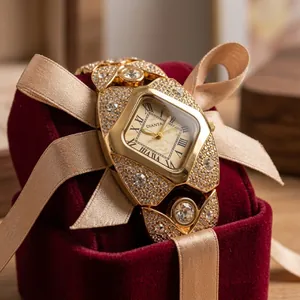 Detailed view of luxury gold women's watch fully encrusted with shimmering crystals