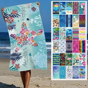 Large microfiber beach towel with vibrant sea life patterns and various print designs
