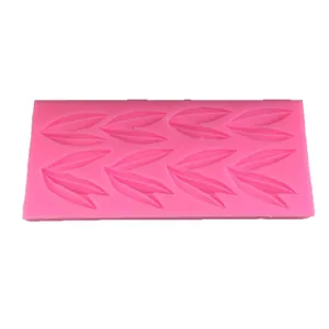 Pink silicone mold with realistic bamboo leaf patterns for DIY fondant and chocolate