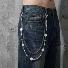 Detail of hip-hop punk double-layer waist chain with metal Cuban links and pearls