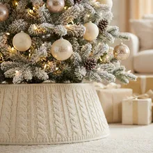 Elegant cream cable knit Christmas tree collar with cozy braided texture ornament