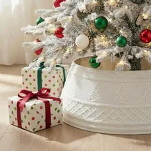 Macro view of a white embossed Christmas tree collar featuring holiday tree and lattice patterns