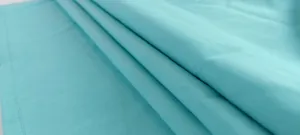 Vista macro della trama del tessuto turchese di qualità per tute da donna