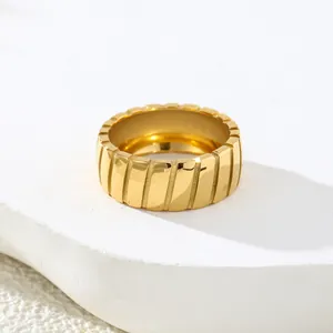 Premium vintage titanium steel ring featuring slanted grooved lines in gold finish