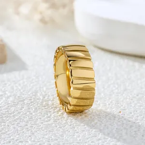 Minimalist vintage gold titanium steel ring featuring elegant slanted line texture details